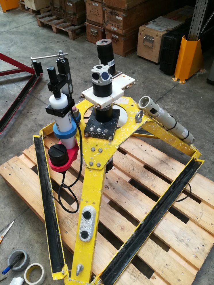 Bottom-mounted tripod cages carrying several monitoring instruments, including RBRvirtuoso³ | Turbidity Loggers