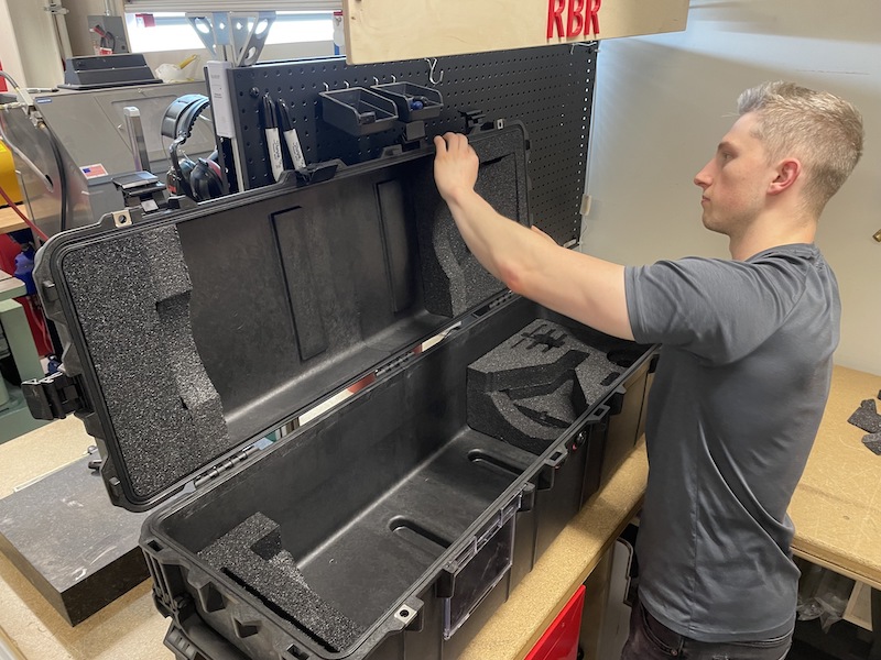 RBR employee opening a transit case