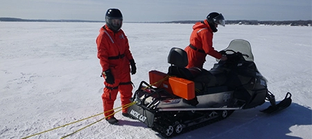 People on snowmobile